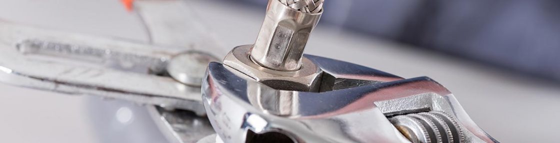 banner-plumbing Wrench on a pipe